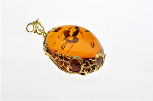 Cognac Baltic See Amber Pendant, decorated with gold plated hand made design, one of a kind