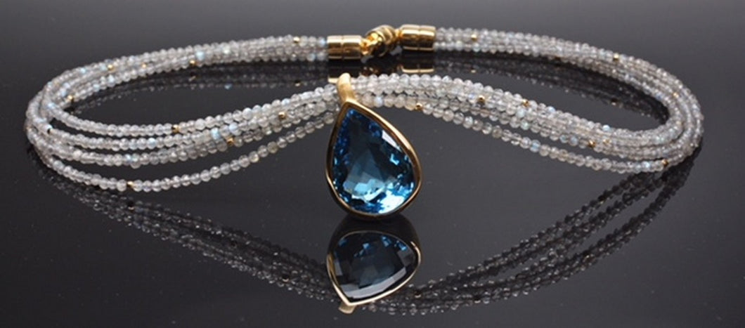 Blue topaz necklace set in sterling silver and gold plated on labradorite beads, very unique cut
